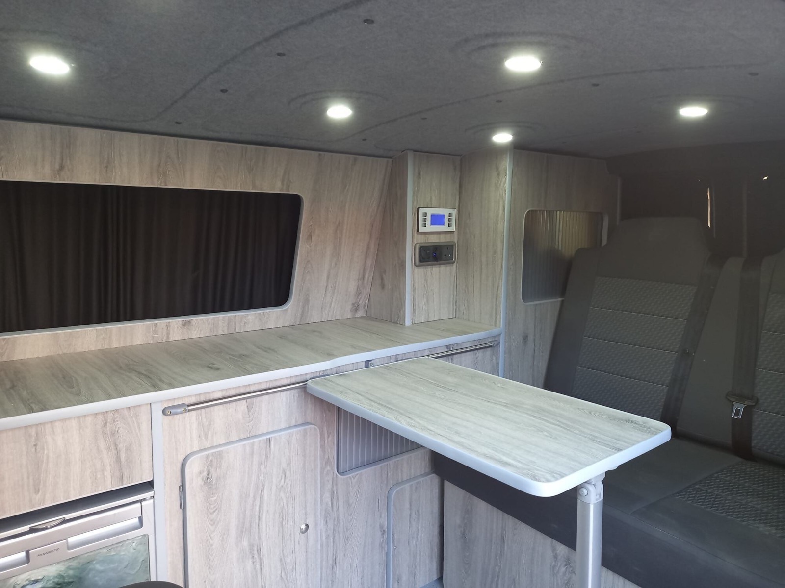 Seating area and window of a van conversion